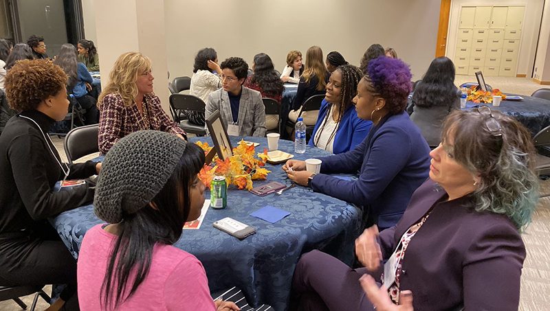 Members of the University community network at a Women’s Leadership Council event before the pandemic.