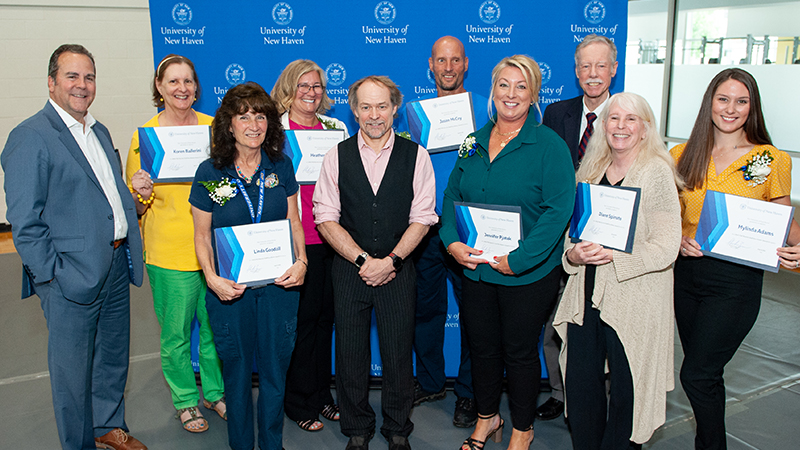 Winners pose with their awards.