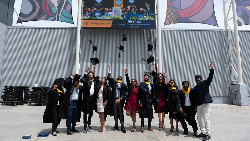 Graduates celebrating at Commencement.