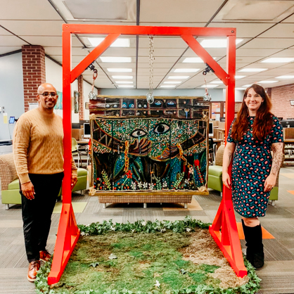 Artist Hector Rodriguez (left) with university librarian Lauren Slingluff, M.S (right)