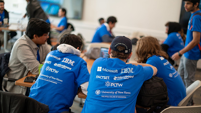 A team of students collaborating during HackNewHaven