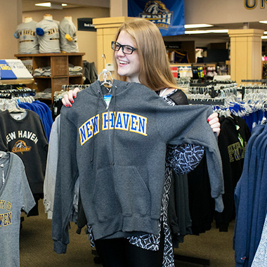 Student trying clothes in campus store