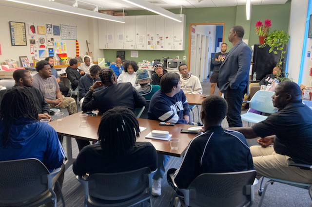 Students listening to a speaker