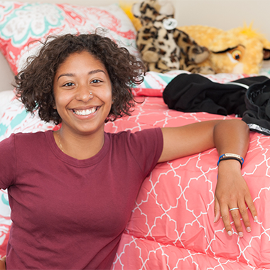 Student relaxing in dorm room