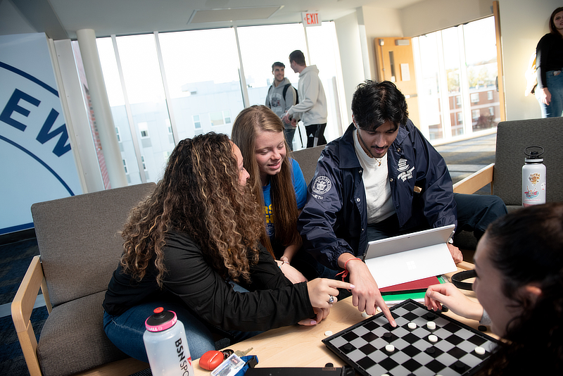 Students playing checkers