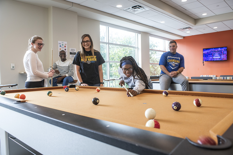 Students playing pool in Westside Hall