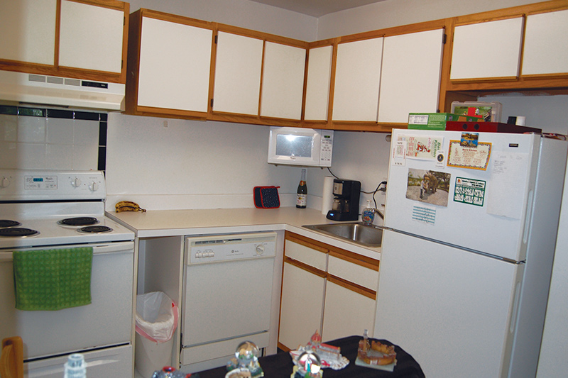 View of kitchen area inside of Forest Hills Apartments