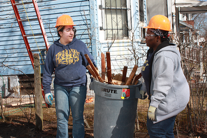 Students clearing garbage